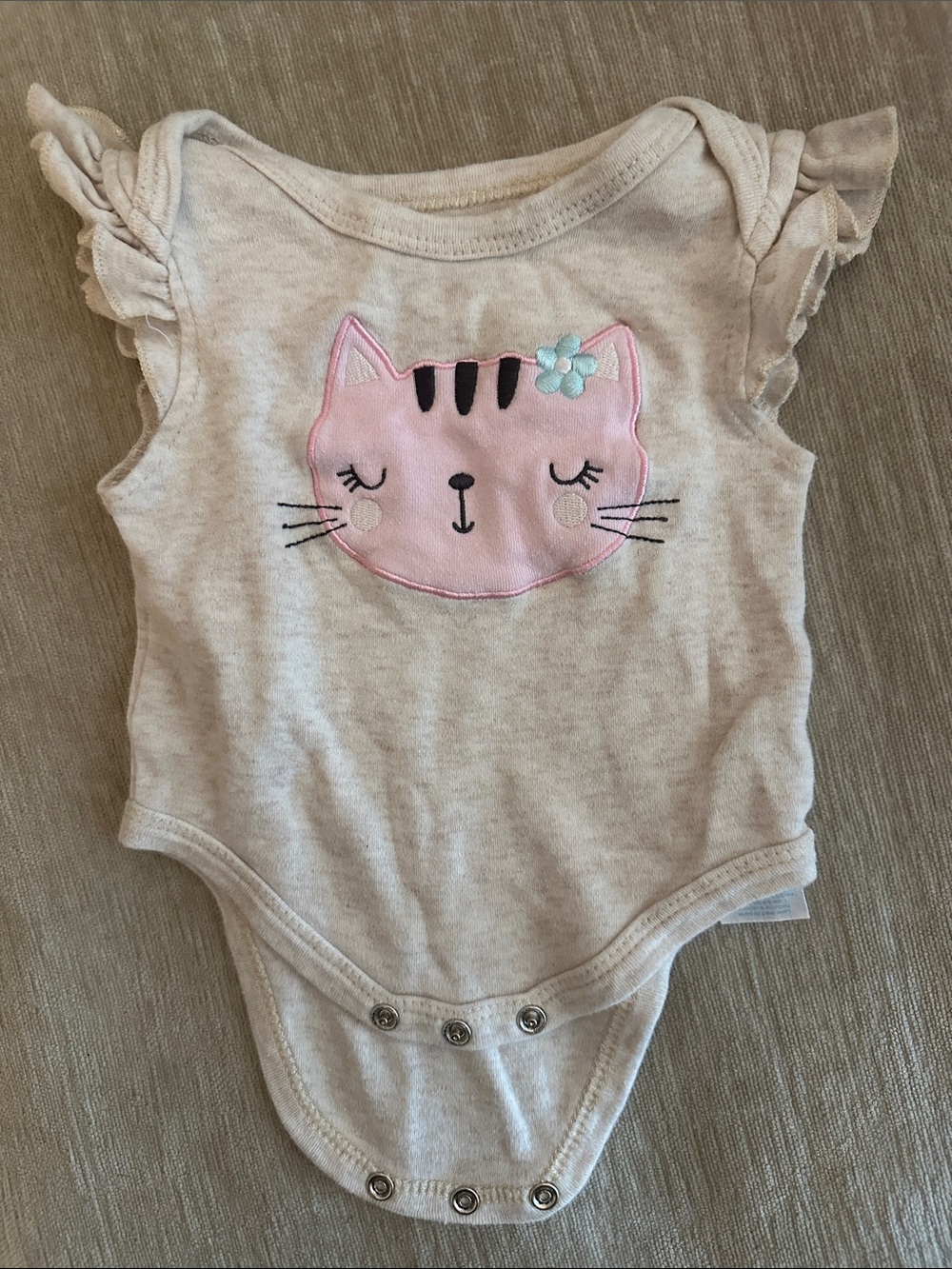 Bon Bebe cream onesie with pink and teal accents